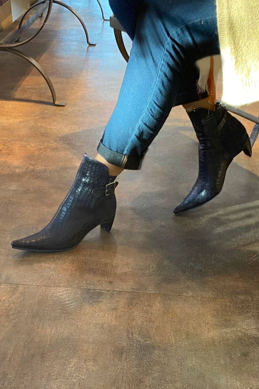 Navy blue women's ankle boots with buckles at the back. Pointed toe. Medium comma heels. Worn view - Florence KOOIJMAN